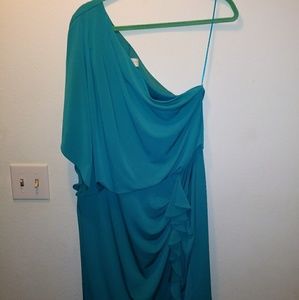 Turquoise one shoulder dress.